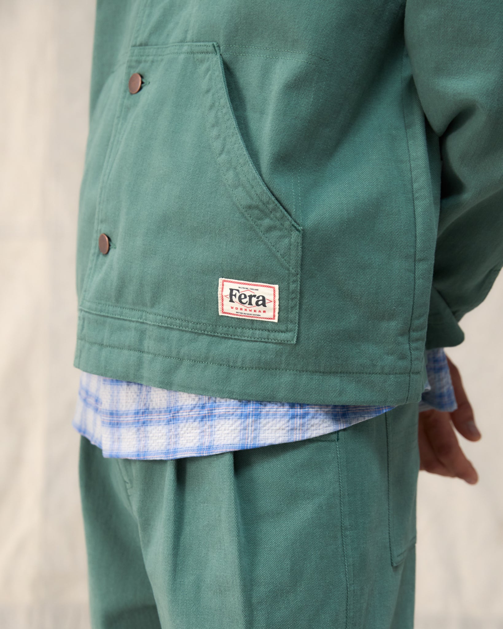 The Fera Low Collar Jacket in a soft washed green cotton