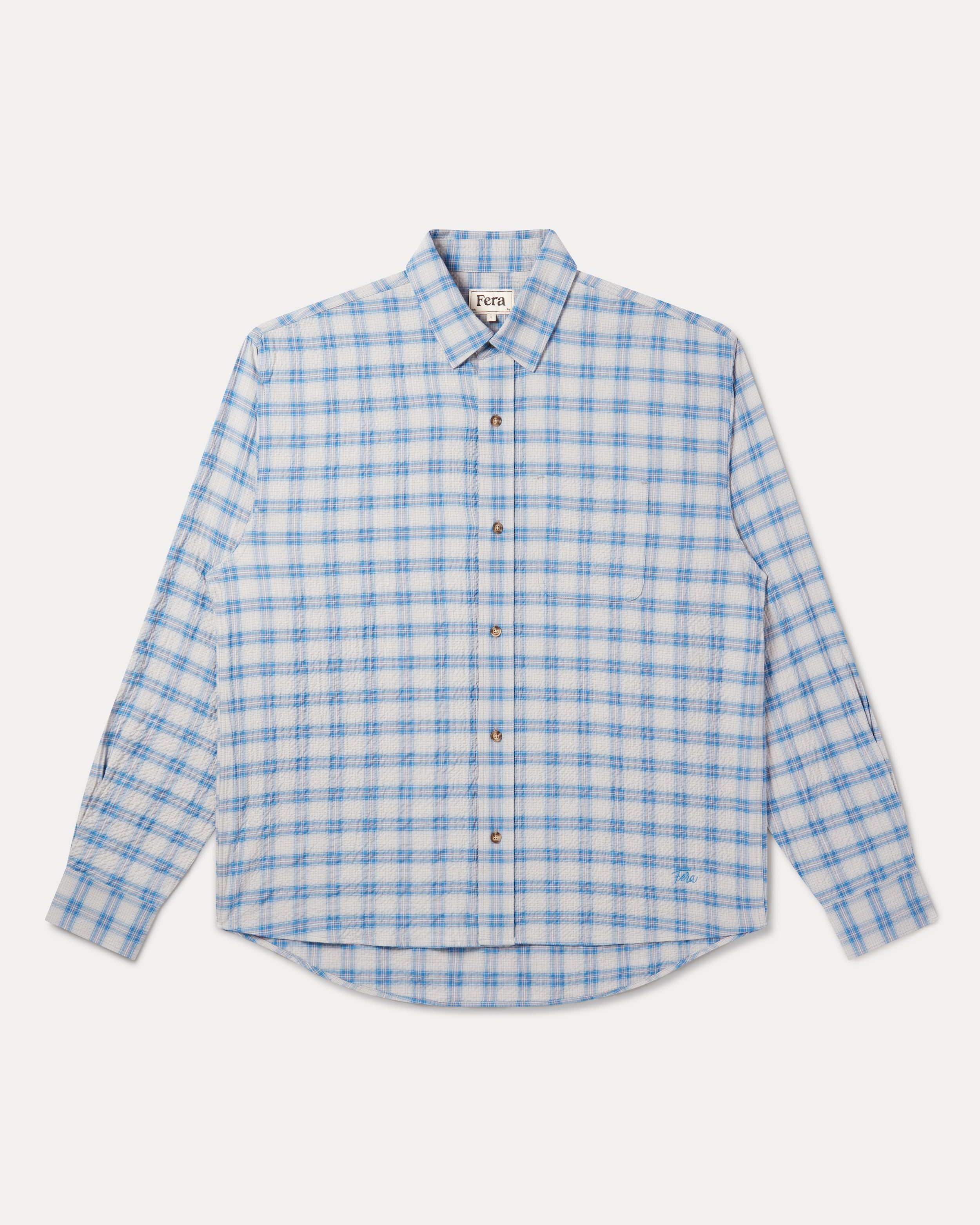 A long-sleeve button-up shirt with a light blue and white checkered pattern: Fera's Avon Shirt in blue and grey seersucker.