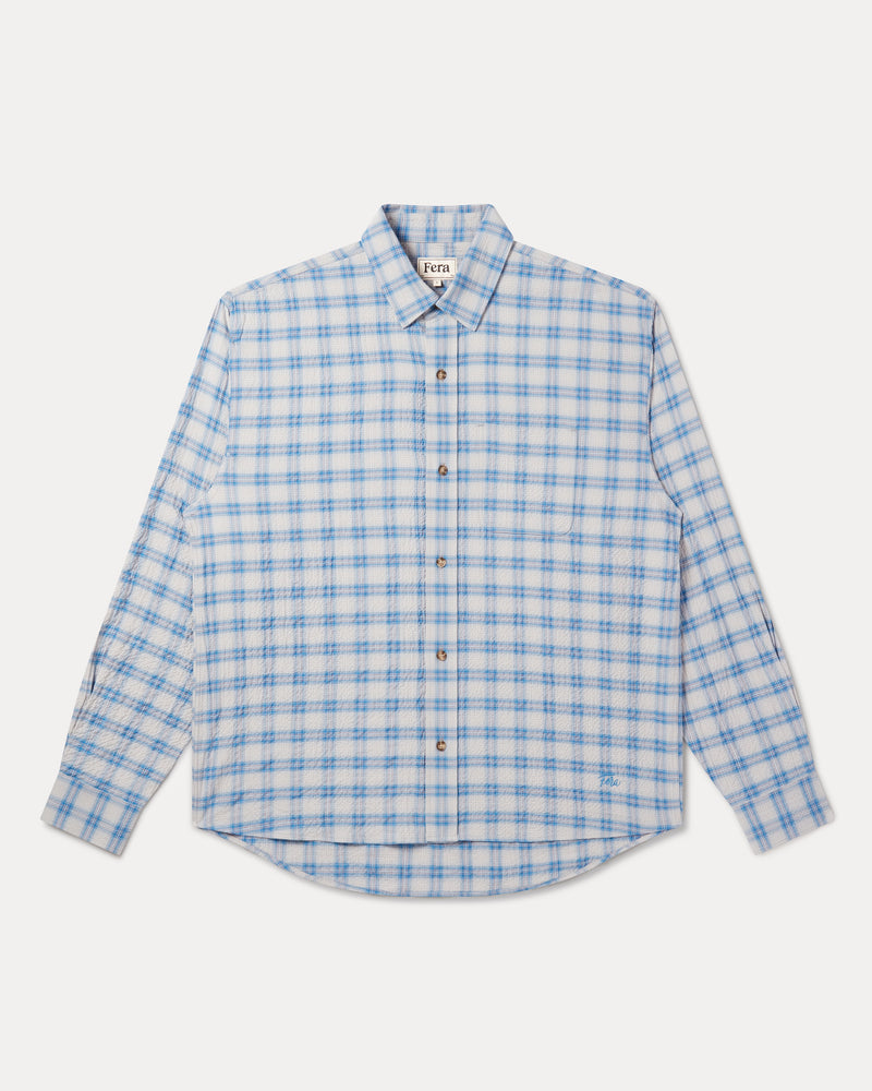 A long-sleeve button-up shirt with a light blue and white checkered pattern: Fera's Avon Shirt in blue and grey seersucker.