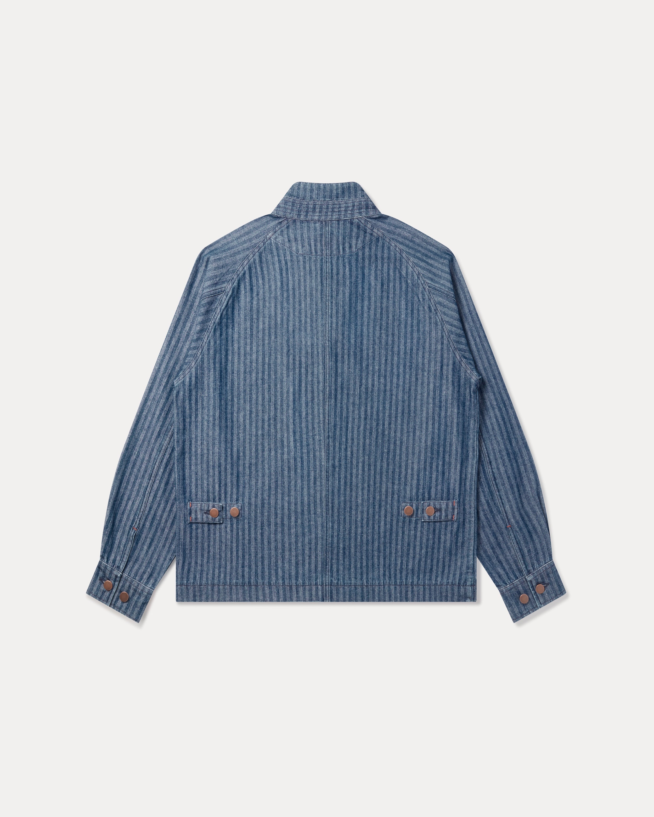 The Fera Uniform Jacket in striped denim, a button-up jacket with a stand collar.