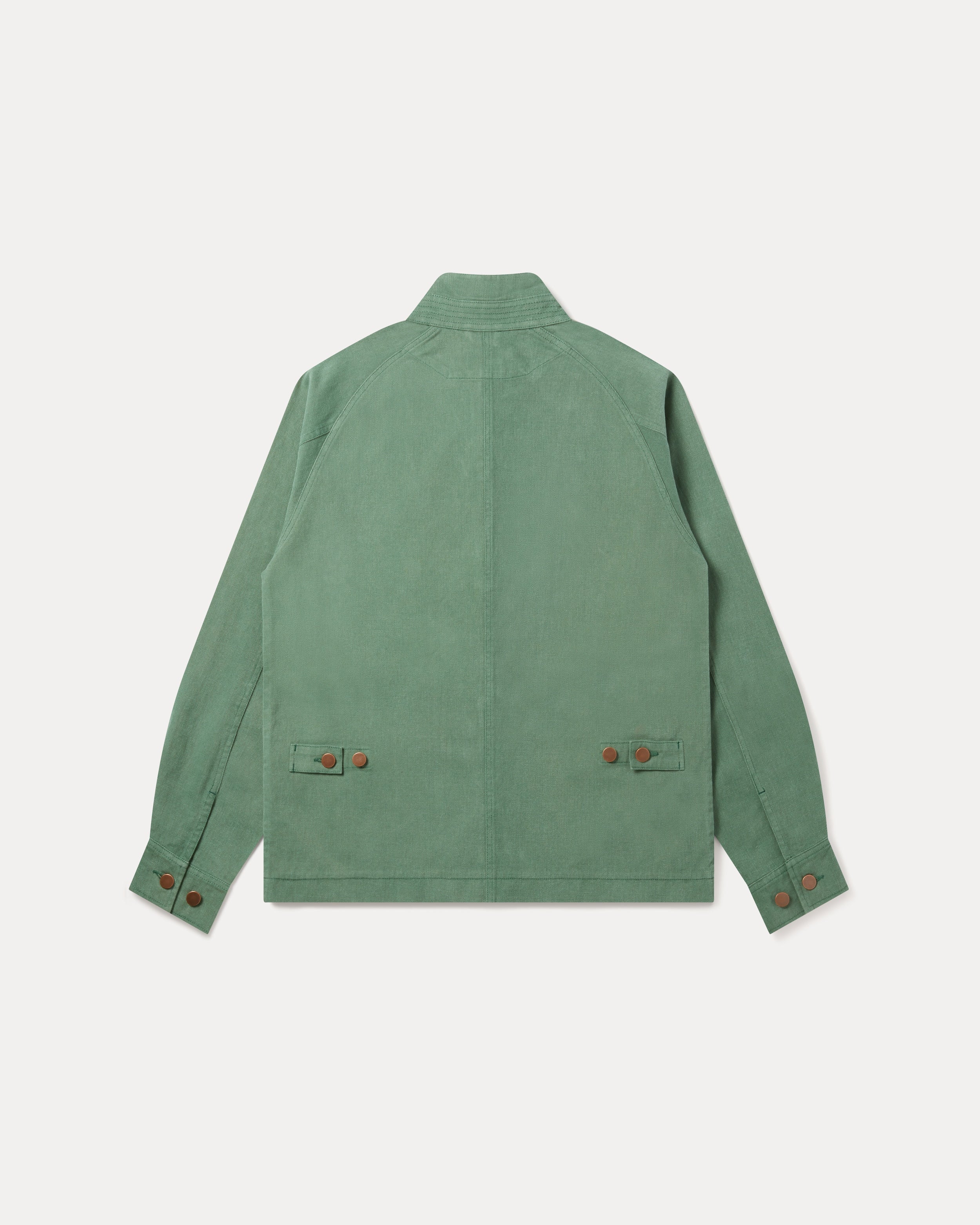 A sage green Fera Low Collar Jacket shown from the back, featuring a high collar, long sleeves, and two flap pockets with small brown buttons on the back, displayed against a light gray background.