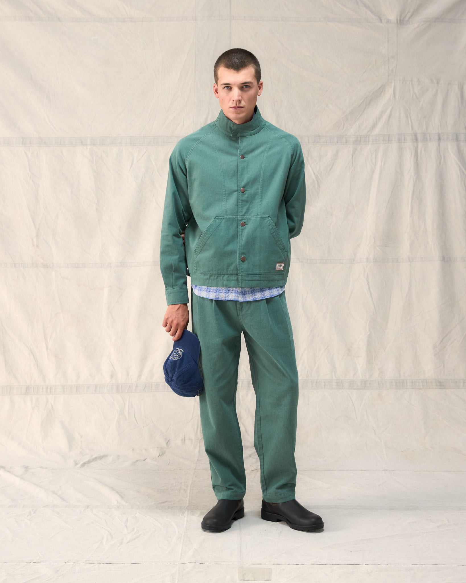 The Fera Low Collar Jacket in a soft washed green cotton