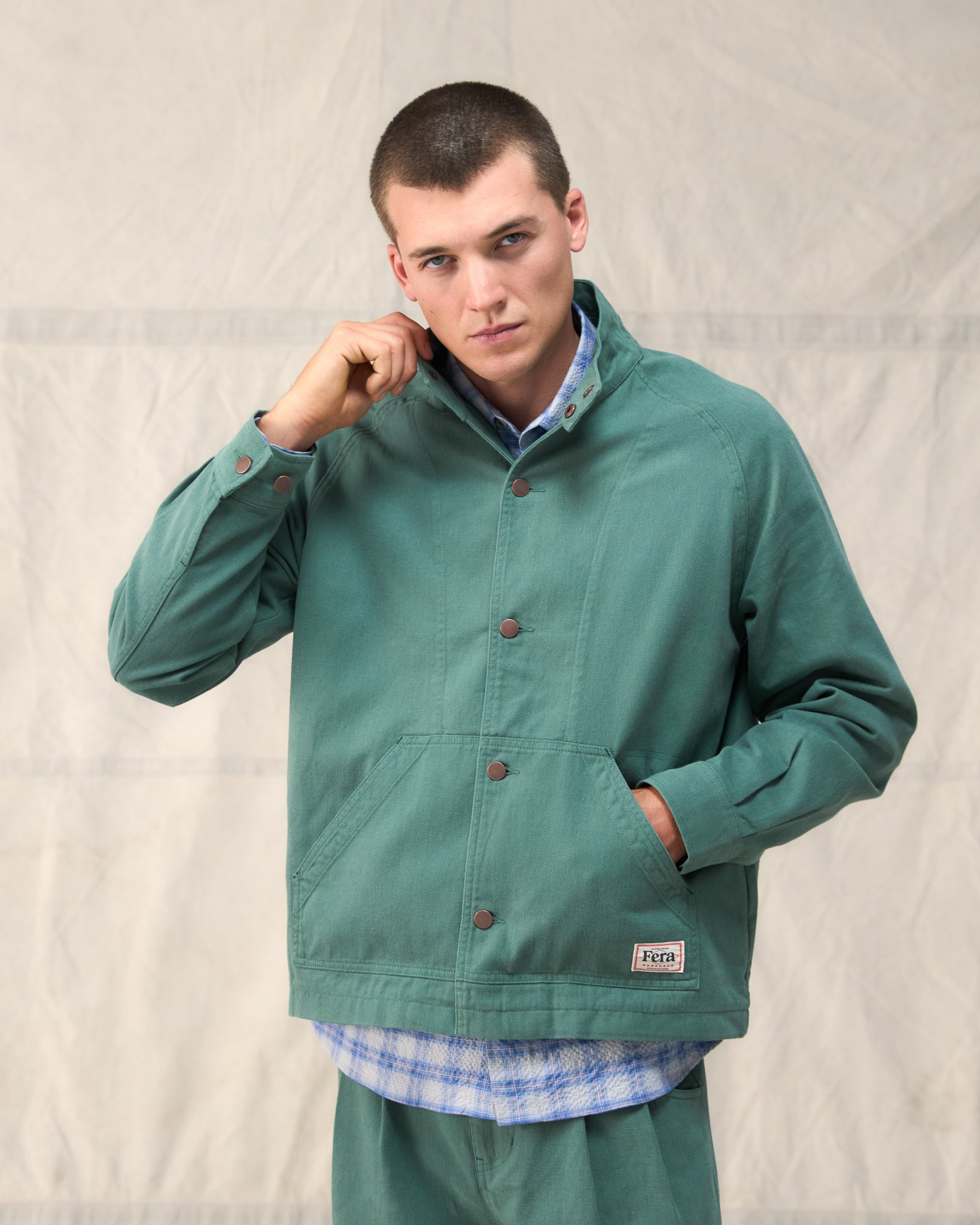 The Fera Low Collar Jacket in a soft washed green cotton