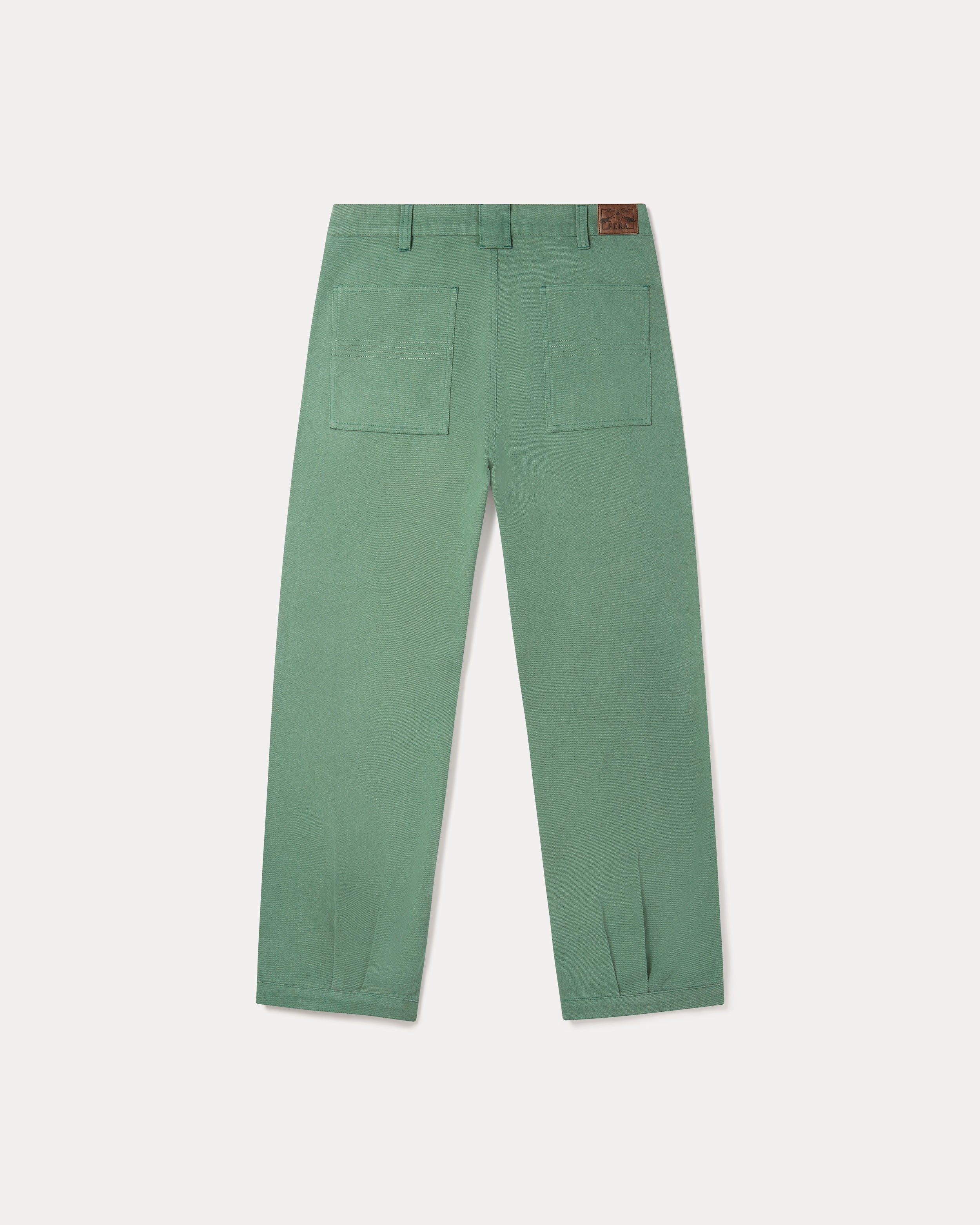 Our Fera Uniform Trousers are cut from a 250gsm washed green cotton and pair a wider, relaxed leg with refined double pleats at the waist.